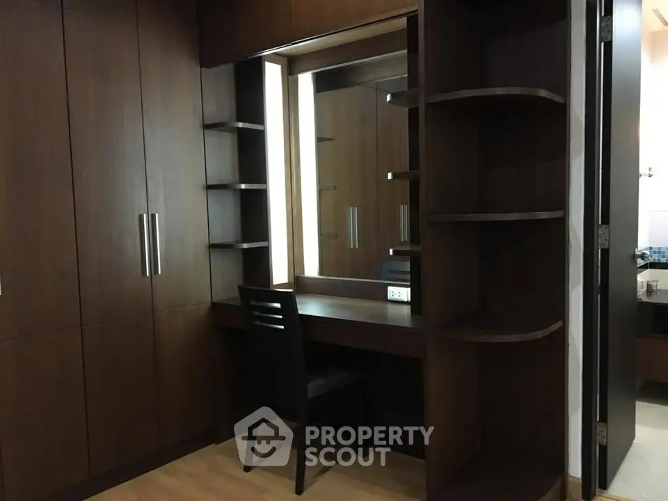 Elegant wooden wardrobe with built-in vanity in modern bedroom
