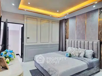 Luxurious modern bedroom with elegant lighting and plush bedding