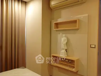 Cozy bedroom with elegant wall decor and air conditioning unit