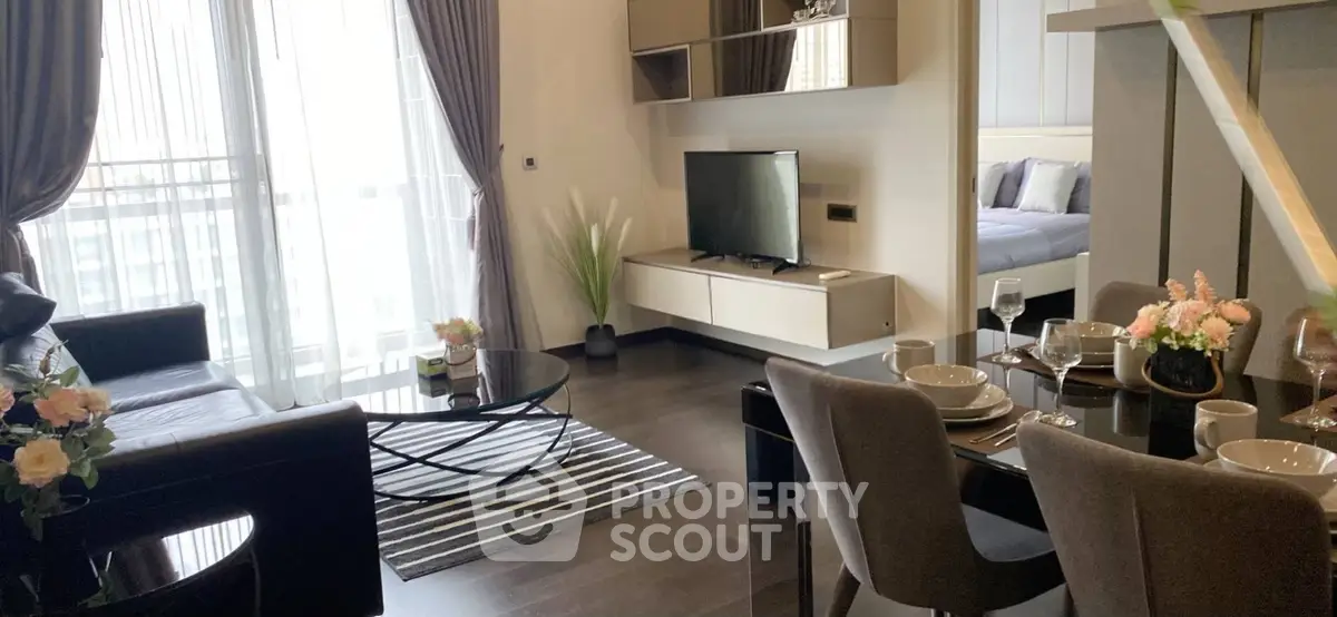 Modern living room with elegant dining area and stylish decor