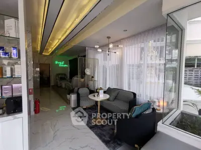 Luxurious modern living room with elegant decor and large windows