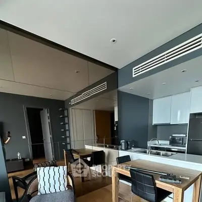 Modern kitchen with sleek design and open layout in contemporary apartment.