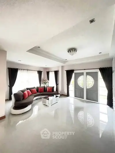 Spacious modern living room with elegant decor and natural light