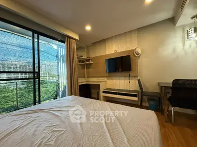 Modern bedroom with balcony access and stylish decor