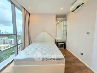 Modern bedroom with city view and sleek design in high-rise apartment