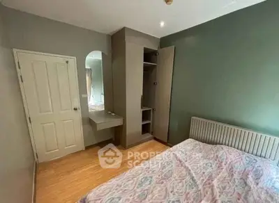 Cozy bedroom with built-in wardrobe and stylish decor