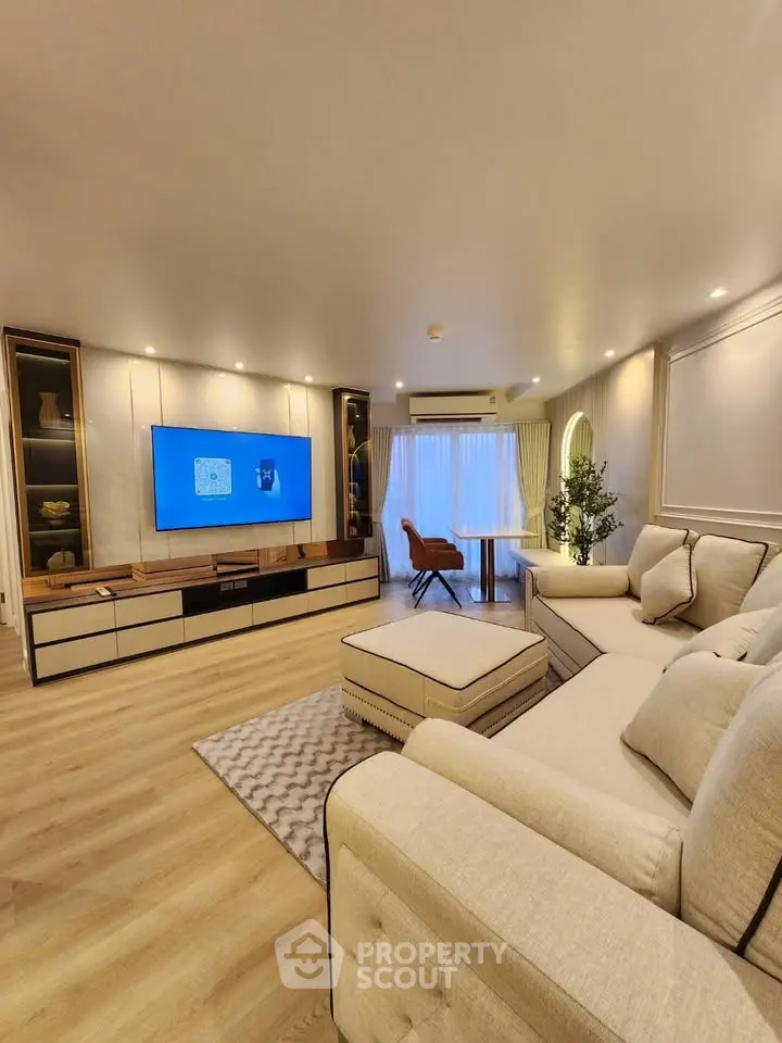 Luxurious modern living room with elegant decor and spacious seating area.