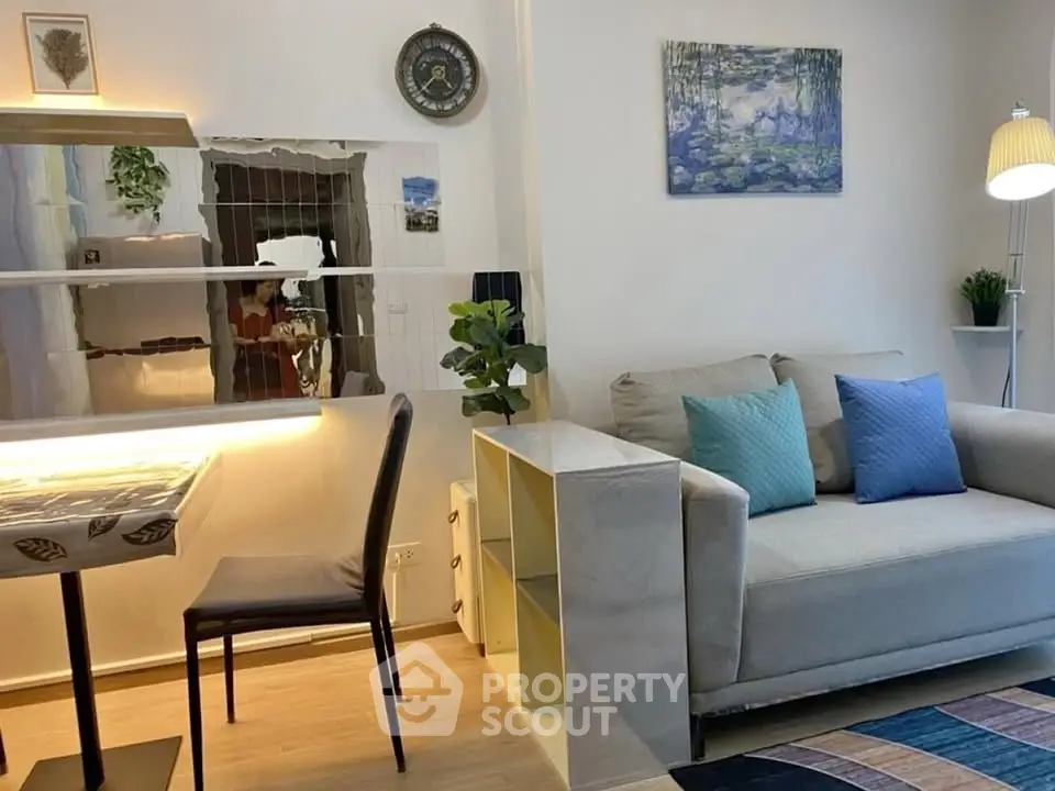 Charming living room with cozy sofa, modern decor, and stylish lighting in a contemporary apartment.