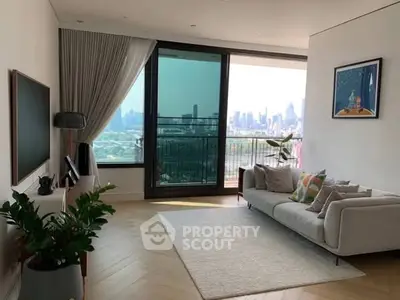 Modern living room with city view, large windows, and stylish decor.