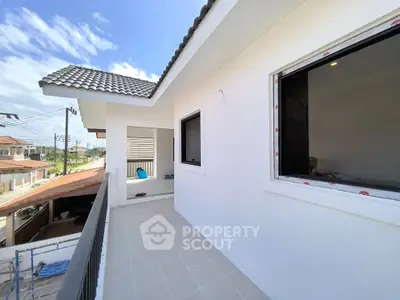 Modern balcony with tiled flooring and scenic neighborhood view