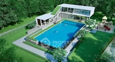 Luxurious modern villa with large pool and lush green surroundings