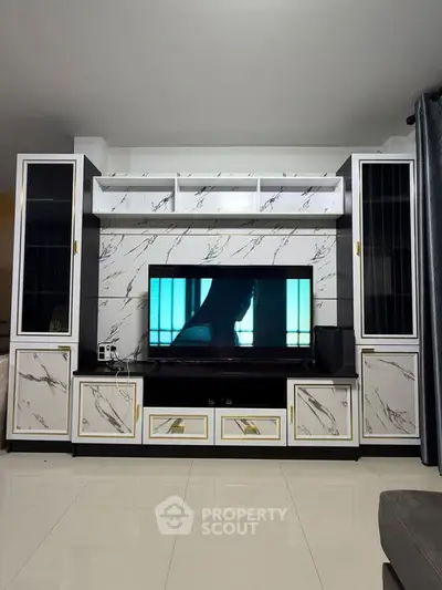 Luxurious living room with elegant marble TV unit and modern decor