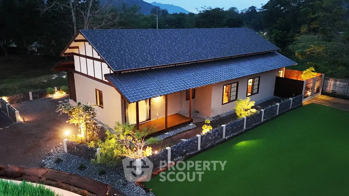 Charming countryside home with modern design and lush green surroundings, perfect for serene living.