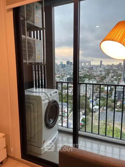 Modern apartment balcony with washing machine and city view