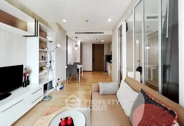 Modern living room with stylish decor and open layout in a cozy apartment.