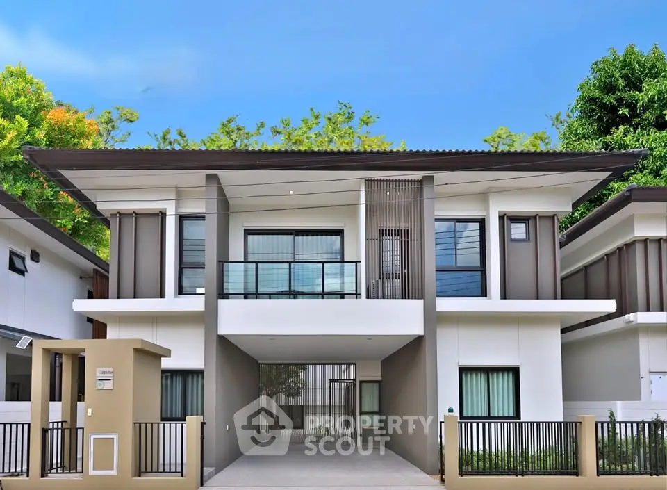 Modern two-story house with sleek design and spacious driveway