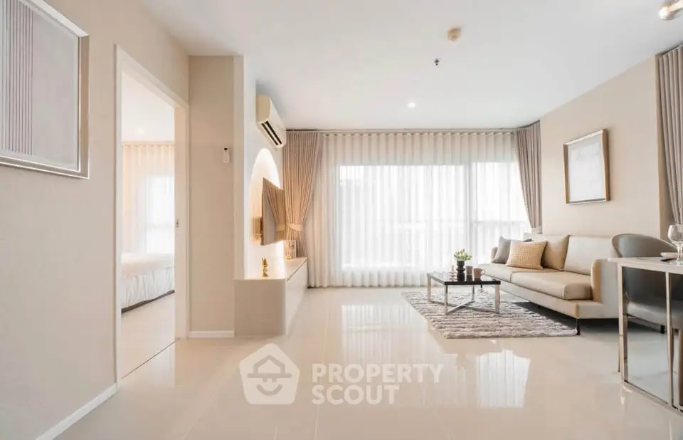 Spacious modern living room with elegant decor and natural light