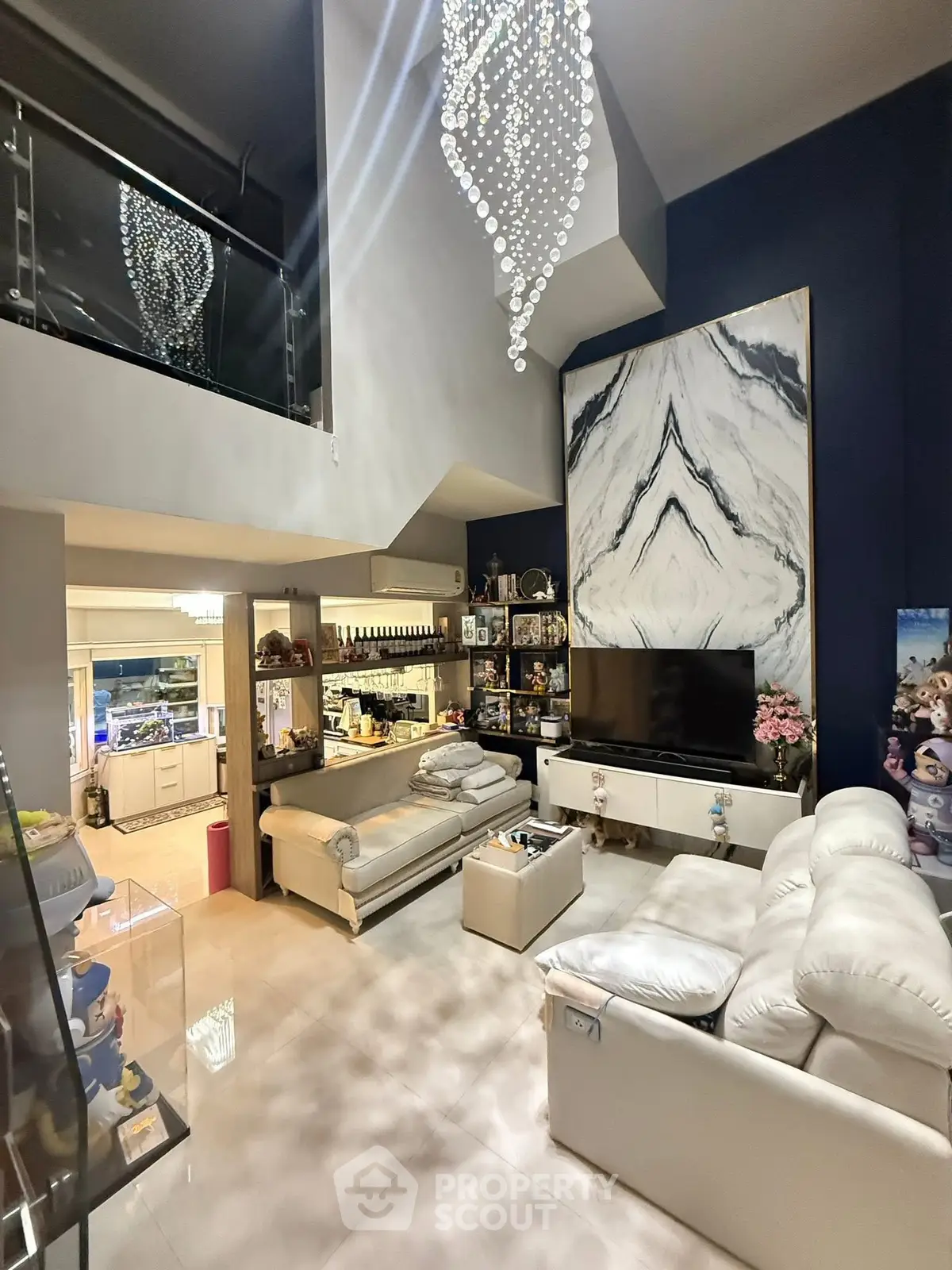 Luxurious living room with high ceiling and elegant chandelier