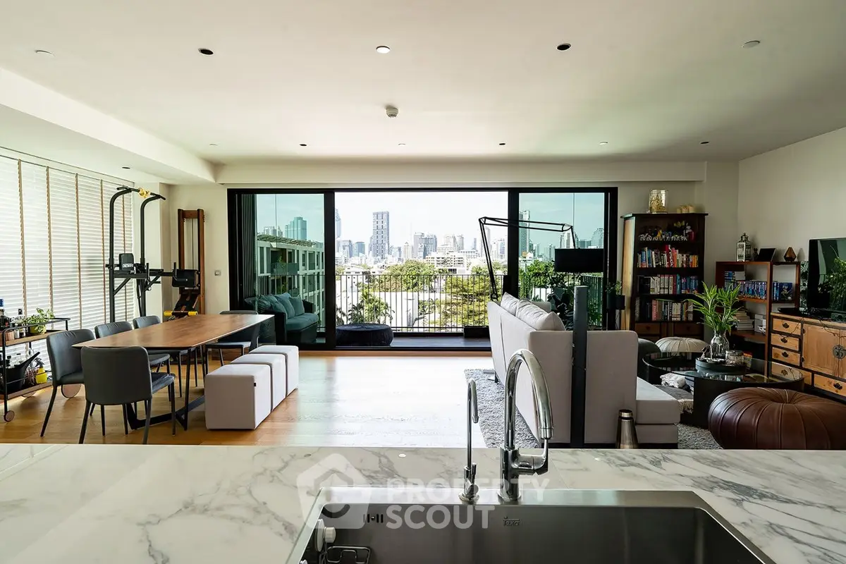 Spacious modern living room with city view, open layout, and stylish decor