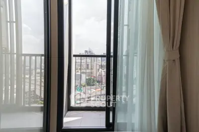 Modern apartment balcony with city skyline view, perfect for urban living enthusiasts.