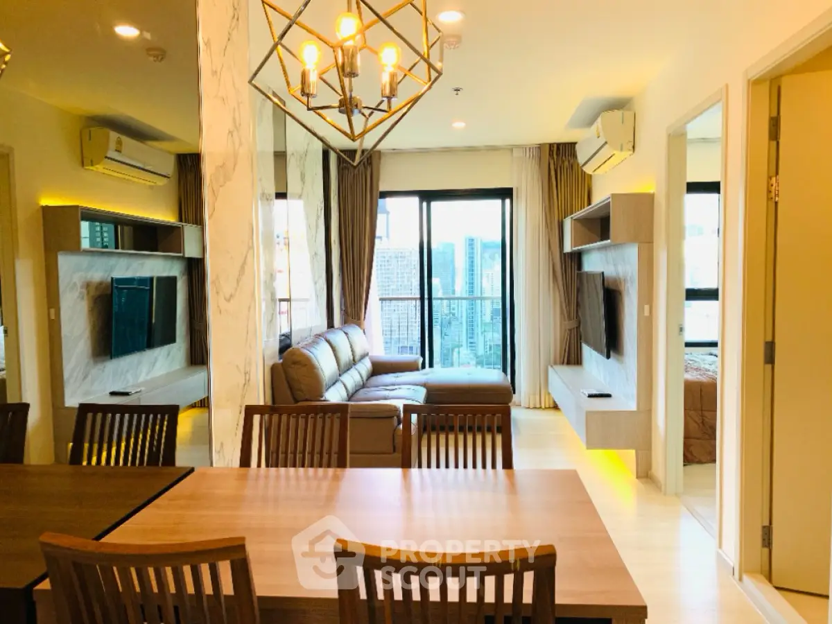 Luxurious modern living room with city view, stylish furniture, and elegant lighting in a high-rise apartment.