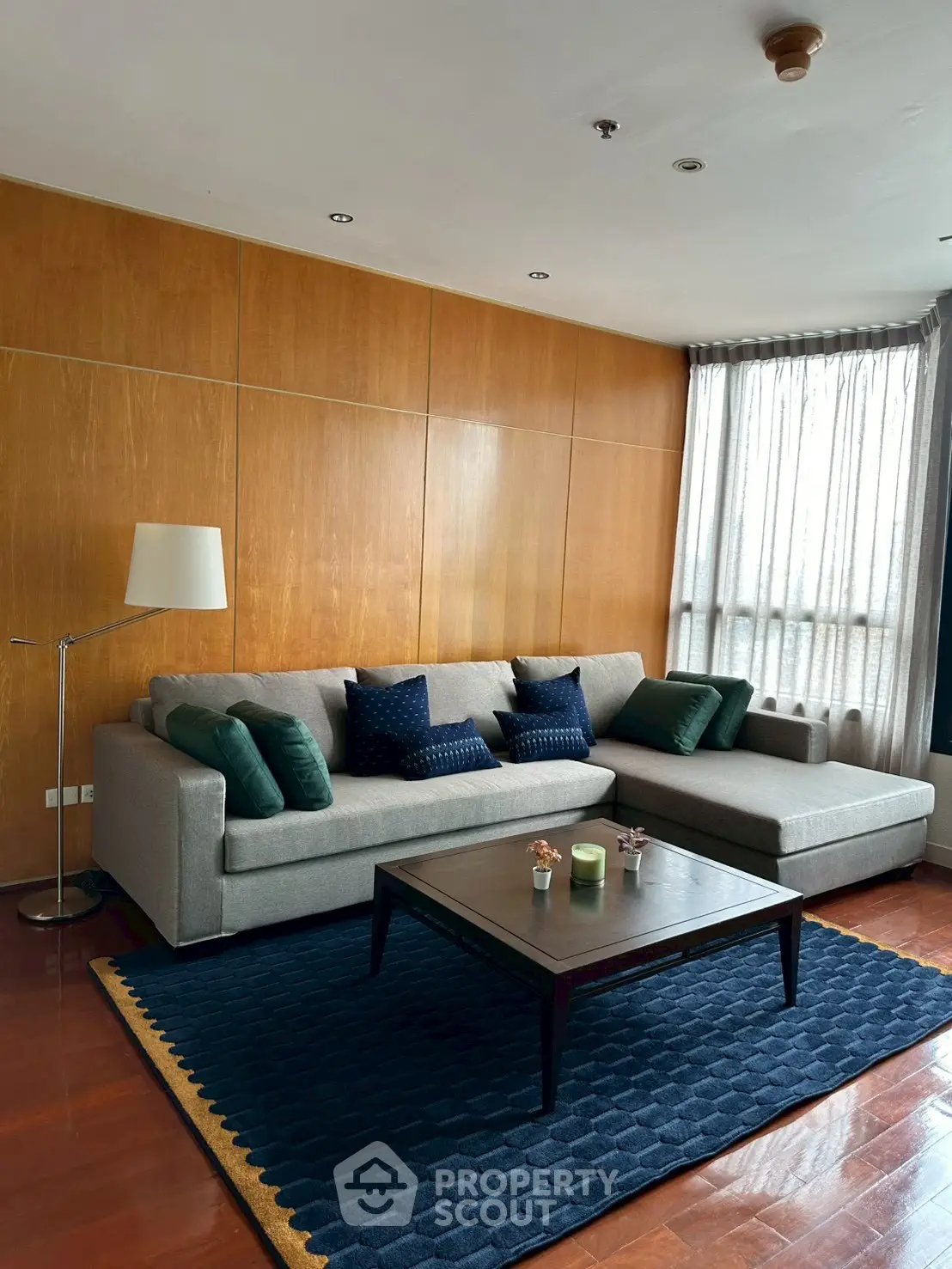 Spacious living room with modern sofa and elegant decor