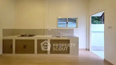 Modern kitchen with gas stove and sleek cabinetry in a bright, open layout.