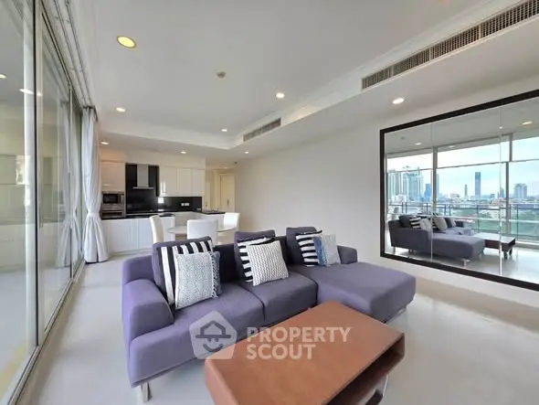 Spacious modern living room with city view and stylish furniture