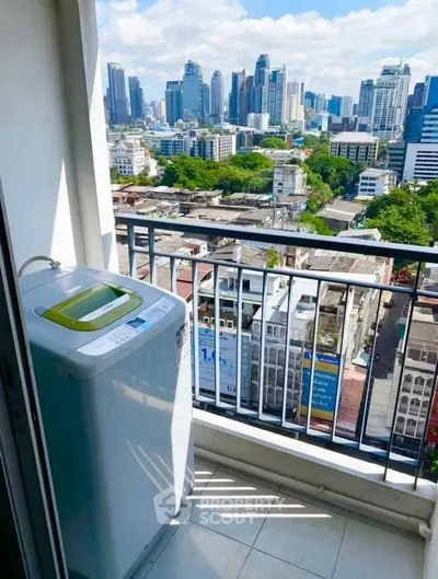 High-rise balcony with washing machine and stunning city skyline view.