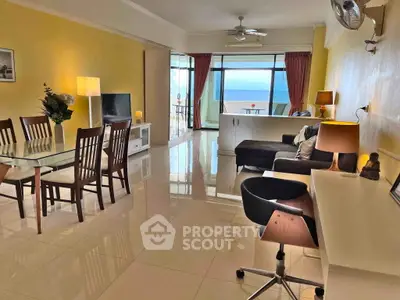 Spacious living room with ocean view and modern furnishings in a luxury apartment.