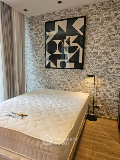 Modern bedroom with stylish wallpaper and cozy lighting