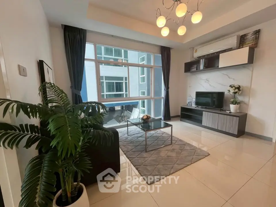 Modern living room with large window and stylish decor