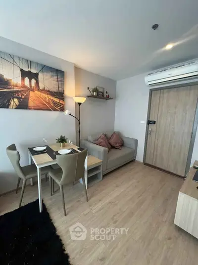Modern living room with cozy dining area and stylish decor in a contemporary apartment.