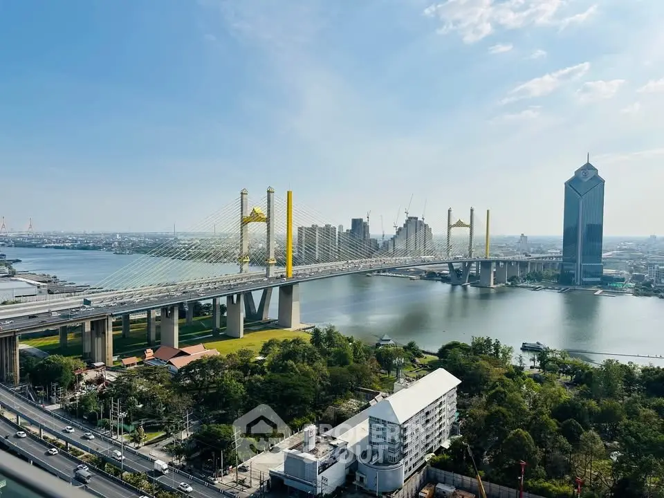 Stunning cityscape view featuring a modern bridge and high-rise buildings by the river.