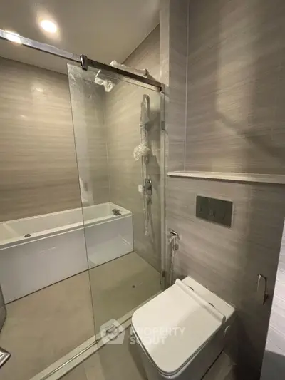 Modern bathroom with glass shower and sleek fixtures
