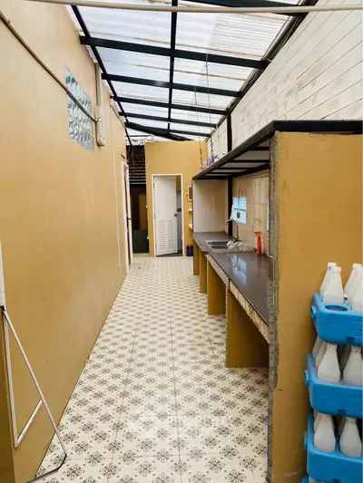 Charming outdoor kitchen with tiled floor and ample counter space