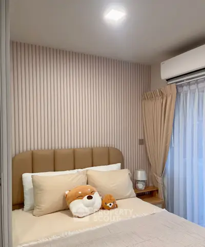 Cozy bedroom with plush decor and modern air conditioning