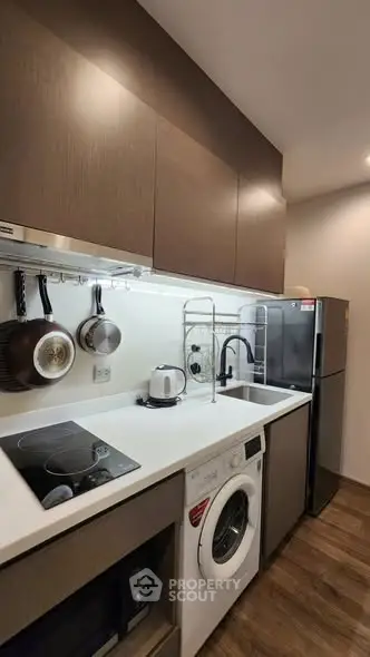 Modern kitchen with sleek appliances and ample storage space
