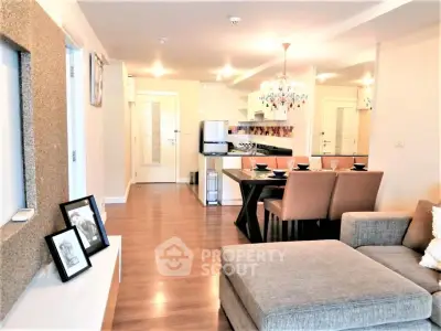 Spacious modern living room with open kitchen and elegant dining area