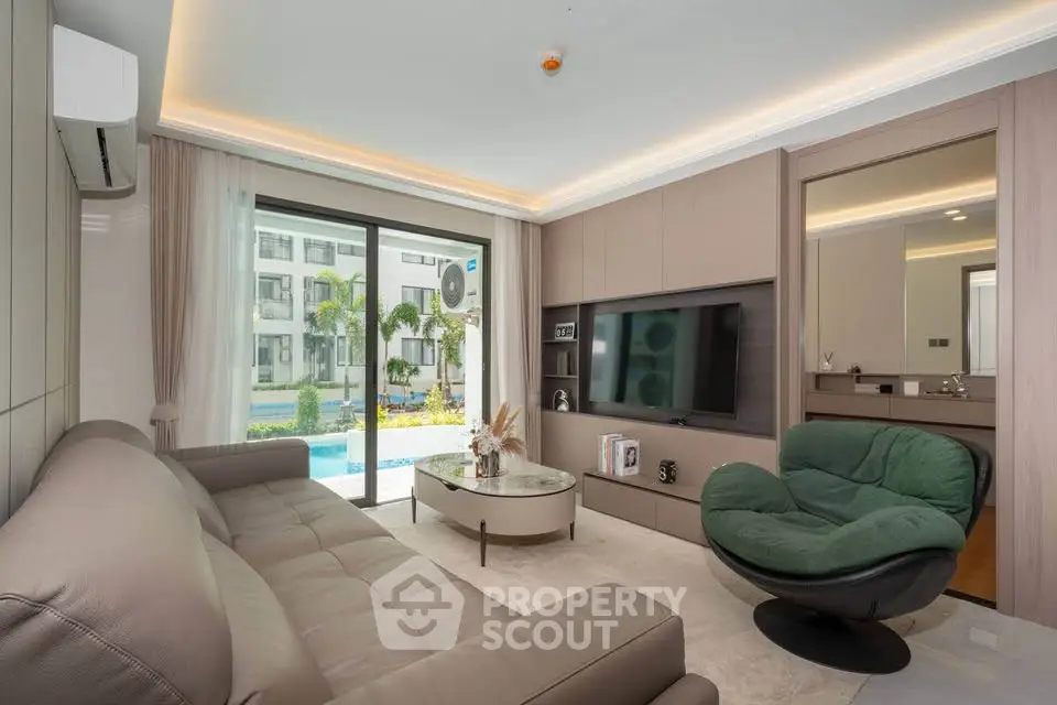 Luxurious living room with modern furniture and pool view in upscale apartment.