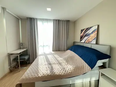 Cozy bedroom with modern decor and natural light