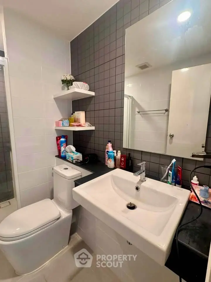 Modern bathroom with sleek fixtures and ample storage space