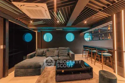 Luxurious modern living room with stylish bar and unique ceiling design