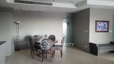 Spacious living room with elegant dining set and modern decor
