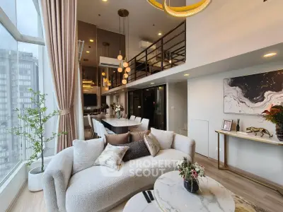 Luxurious modern living room with high ceilings and elegant decor in a stylish apartment.