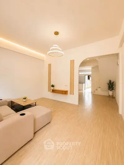 Spacious modern living room with elegant lighting and minimalist decor