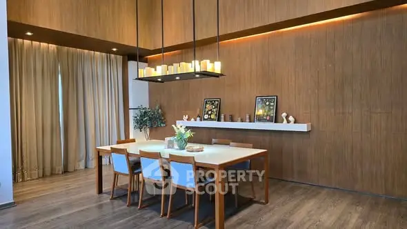 Elegant dining area with modern lighting and wooden accents
