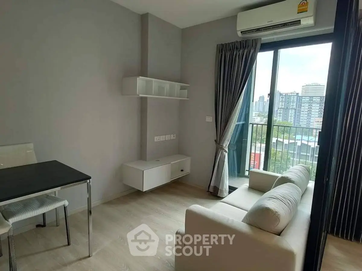Modern living room with balcony view in urban apartment