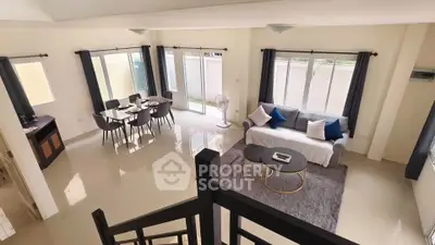 Spacious modern living room with dining area and large windows