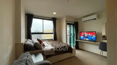 Modern bedroom with balcony and smart TV in urban apartment